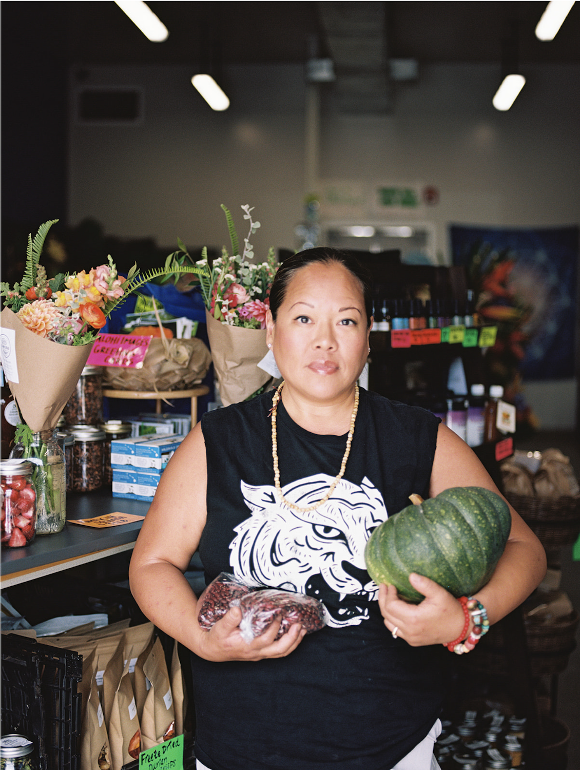 Maui fires in Lahaina featuring chef Lee Anne Wong, whose Lahaina restaurant, Papa’aina, was destroyed last year, selects fresh produce at the upcountry Okoa Store